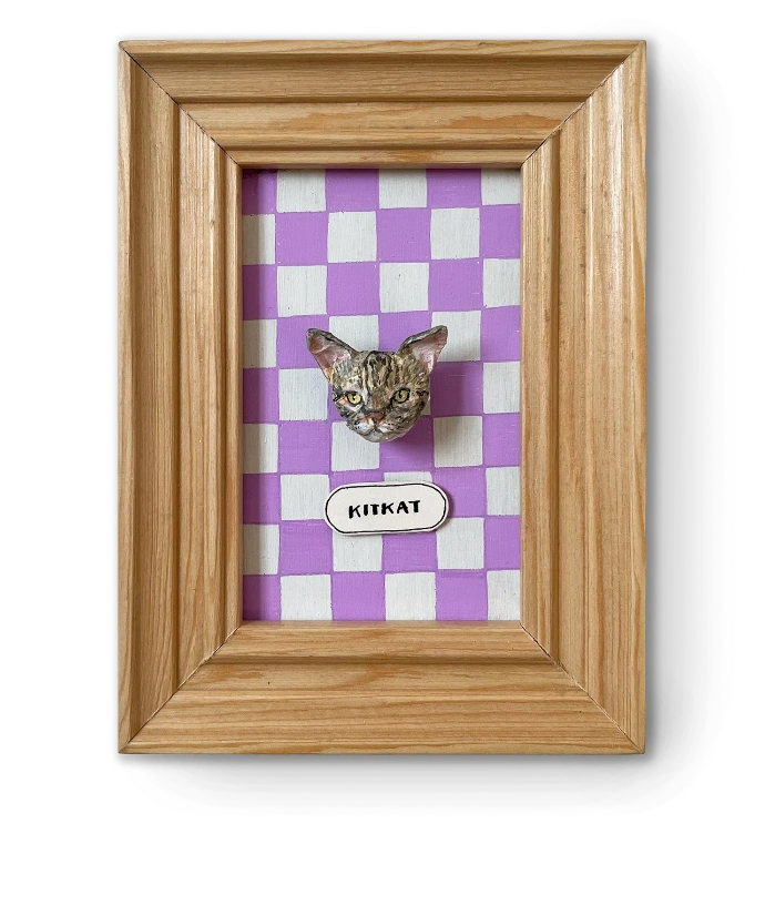 Handmade papier-mâché pet portrait in a colorful polka-dot frame