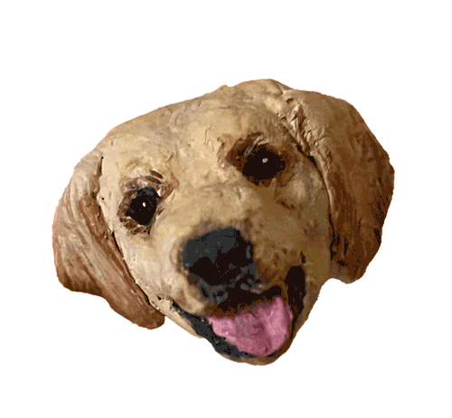 Handmade papier-mâché portrait of a golden dog