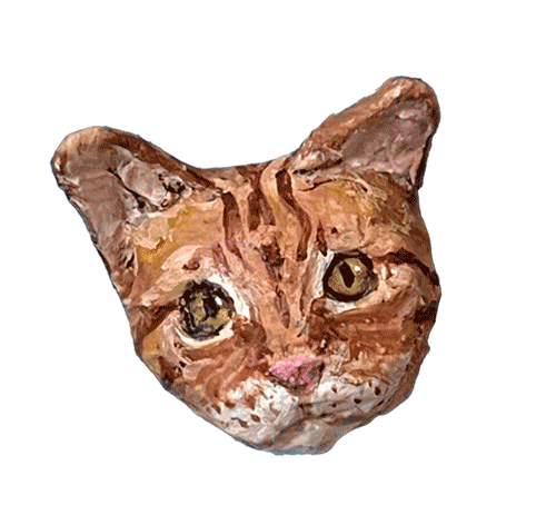 Handmade papier-mâché portrait of an orange tabby cat